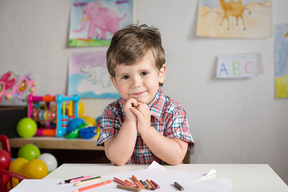 Happy preschooler back to school at a Preschool & Daycare Serving Carmel, Indiana