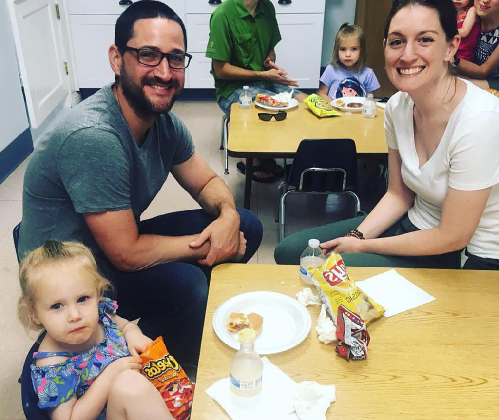 cute toddler with parents at a Preschool & Daycare Serving Carmel, Indiana