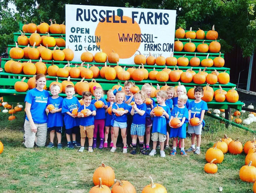 happy children at pumpkin farm at a Preschool & Daycare Serving Carmel, Indiana