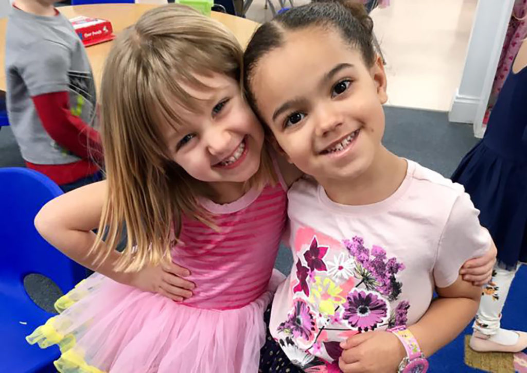 two smiling friends at a Preschool & Daycare Serving Carmel, Indiana